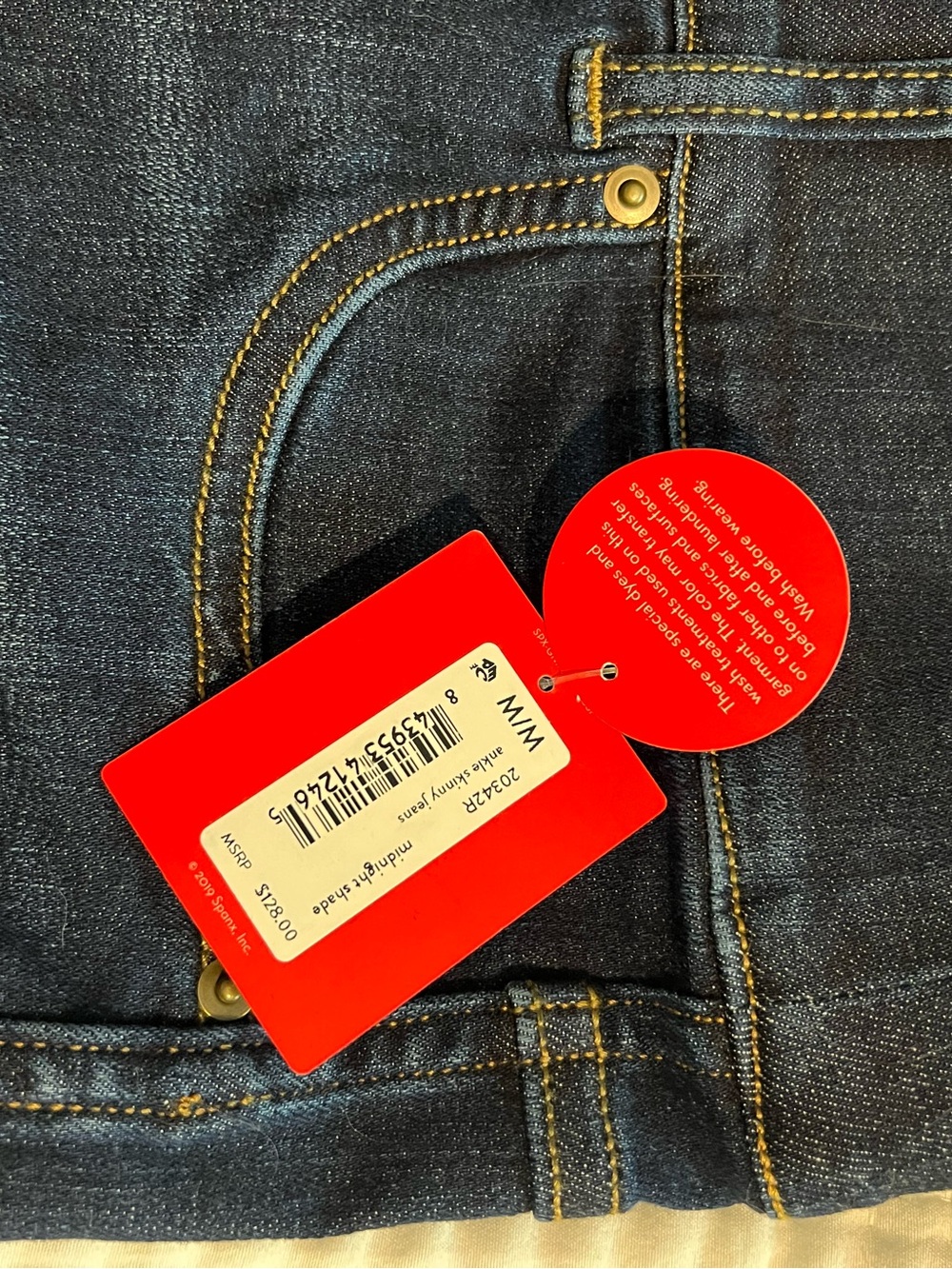 SPANX Dark Indigo Slim Jeans with Yellow Stitching and Red Tags